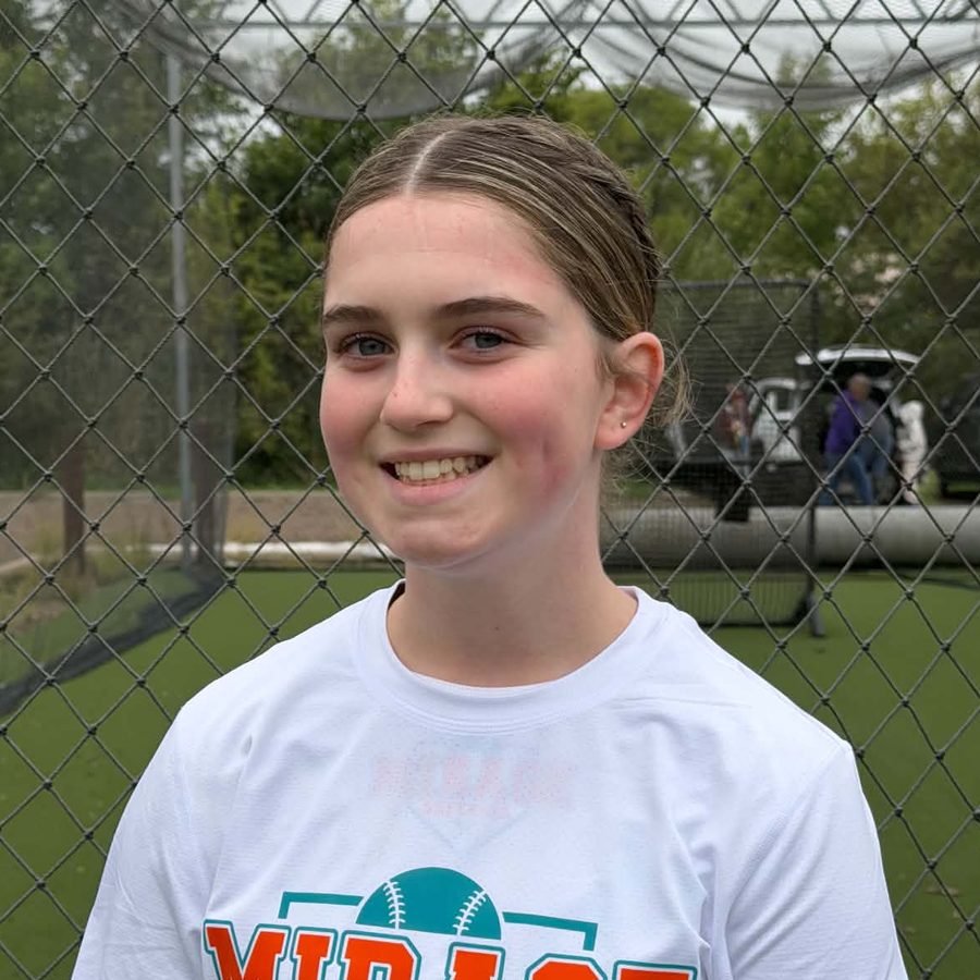 Kennedy G. in a Mirage Softball shirt at the batting cages