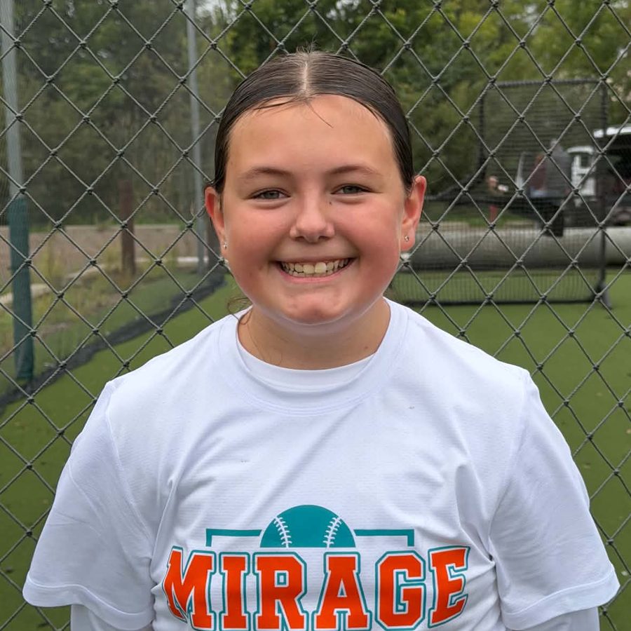 Harper H. in a Mirage Softball shirt at the batting cages